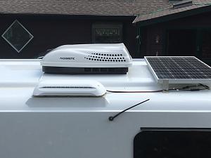 Frig vent with solar panel wires entering.jpg
