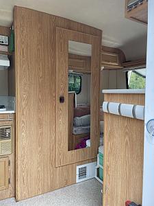 9-door to bath with mirror view and single dinette.jpg
