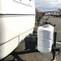 Two new 6 volt batteries, two propane tanks, solar trickle charger.