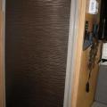 Covered over wood-look Fridge door panel with Fasade "Ripples" panel. Available at Home Depot & Lowes - see fasadeideas.com