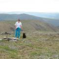 Top of the world "Yukon" Us border. And that's Lucy Dog with the navigator AKA "The Boss" .